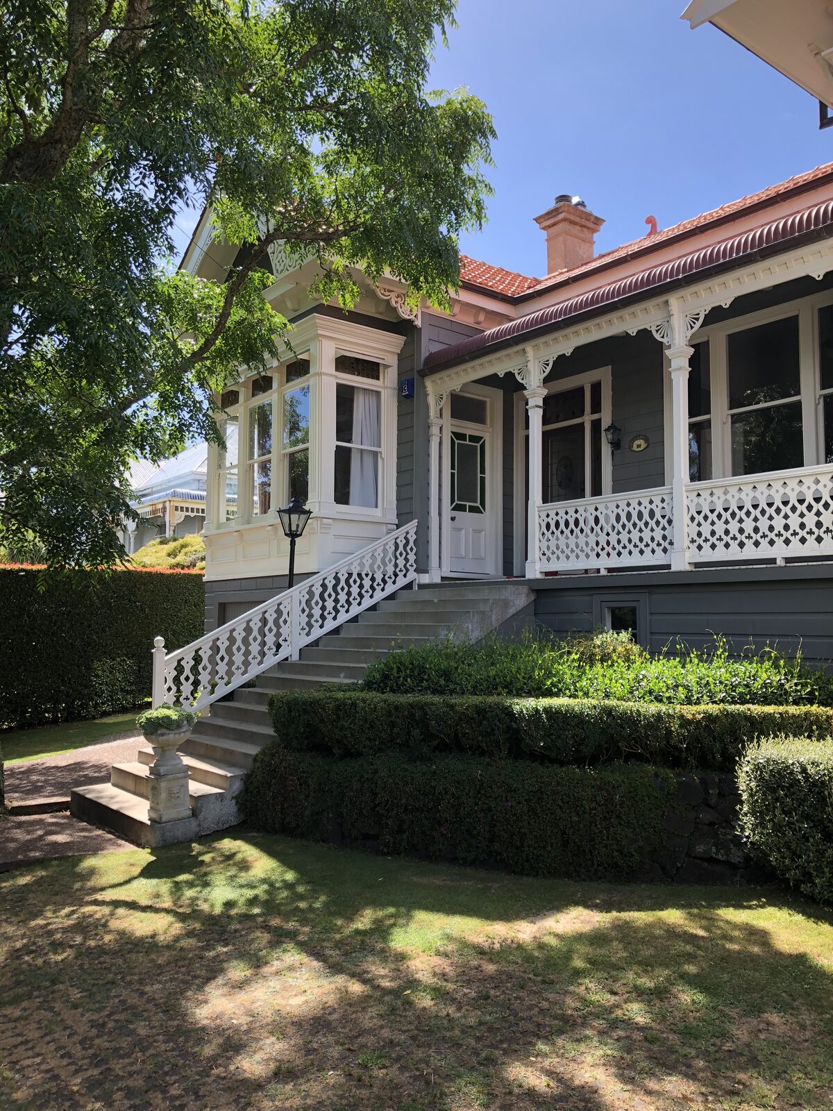 The 1905 heritage villa, Devonport: front elevation, bay window, fretwork veranda